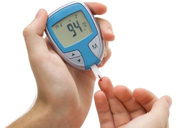 Picture of someone measuring their sugar for diabetes